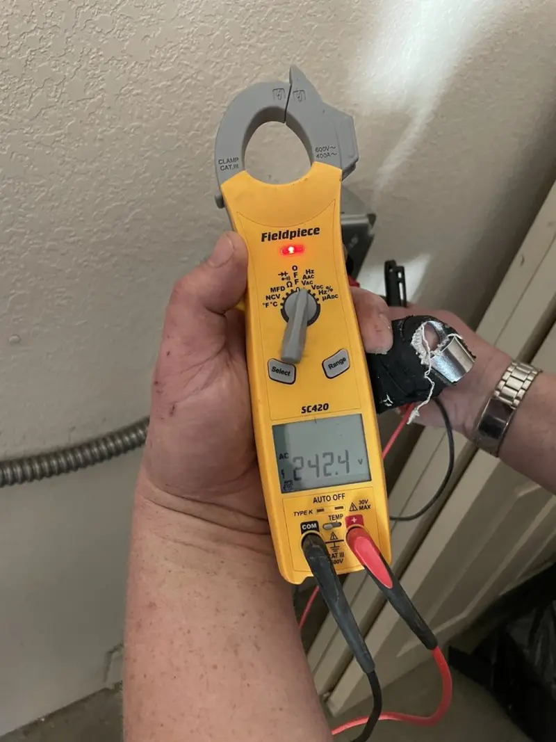 Voltage testing with clamp meter during Outlet Installation in St. Helens